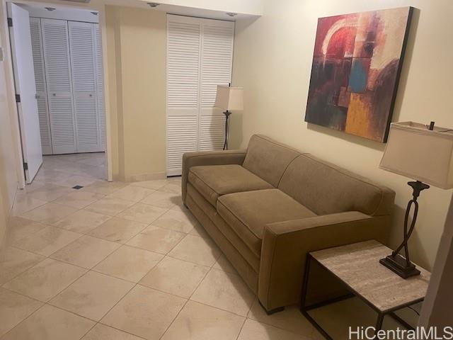 1088 Bishop Street, Unit 3606 Honolulu, HI 96813 - Photo 4 of 19 a living room with furniture and a rug