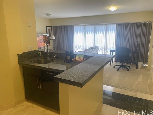 1088 Bishop Street, Unit 3606 Honolulu, HI 96813 - Photo 6 of 19 a bathroom with a granite countertop sink and a mirror