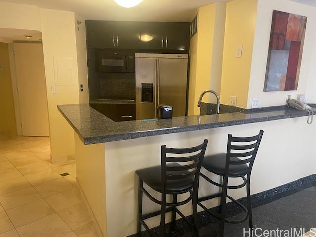 1088 Bishop Street, Unit 3606 Honolulu, HI 96813 - Photo 7 of 19 a bathroom with a granite countertop sink and a mirror