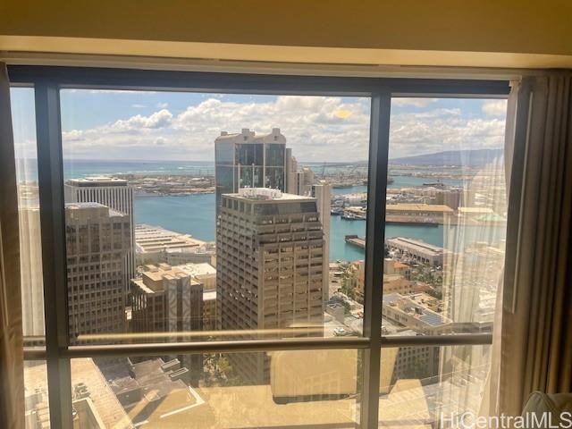1088 Bishop Street, Unit 3606 Honolulu, HI 96813 - Photo 10 of 19 a view of a glass building from a window