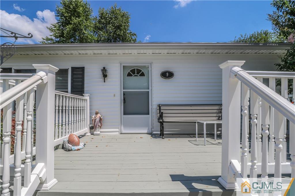 9 Morley Road, Unit 9 North Brunswick, NJ 08902 - Photo 16 of 19 a view of a house with backyard and sitting area