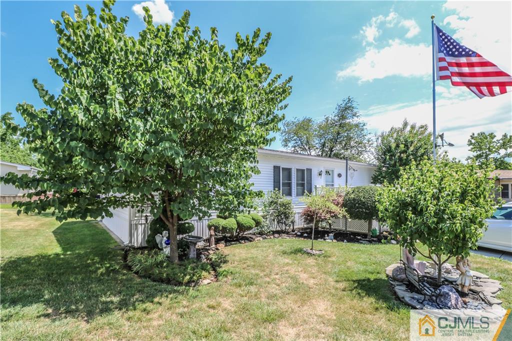 9 Morley Road, Unit 9 North Brunswick, NJ 08902 - Photo 17 of 19 a view of a house with a yard and garden