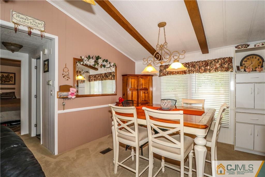 9 Morley Road, Unit 9 North Brunswick, NJ 08902 - Photo 7 of 19 a dining room with furniture and window