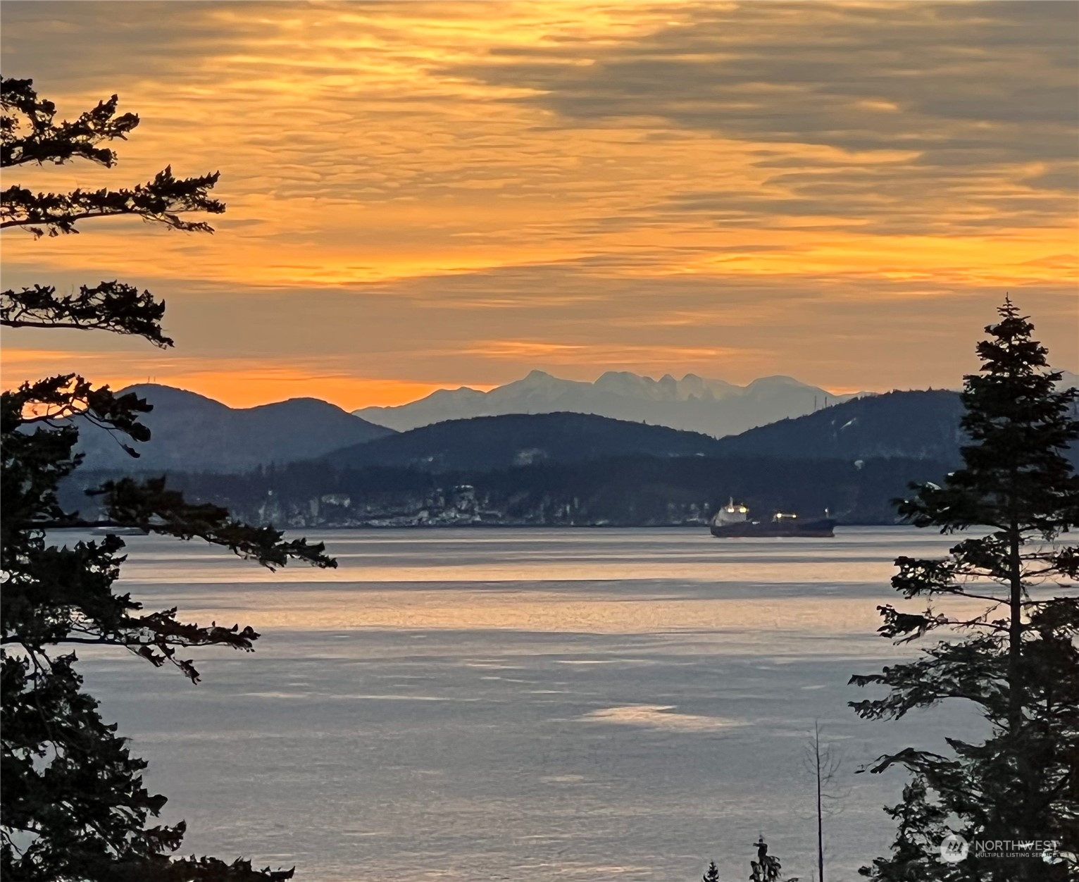 a view of ocean and mountain