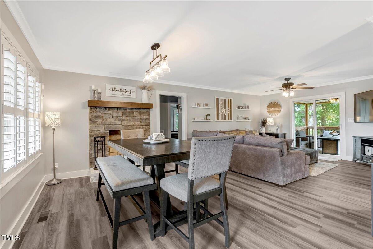 1856 Flat Rock Church Road Louisburg, NC 27549 - Photo 4 of 30 a view of a dining room with furniture and wooden floor