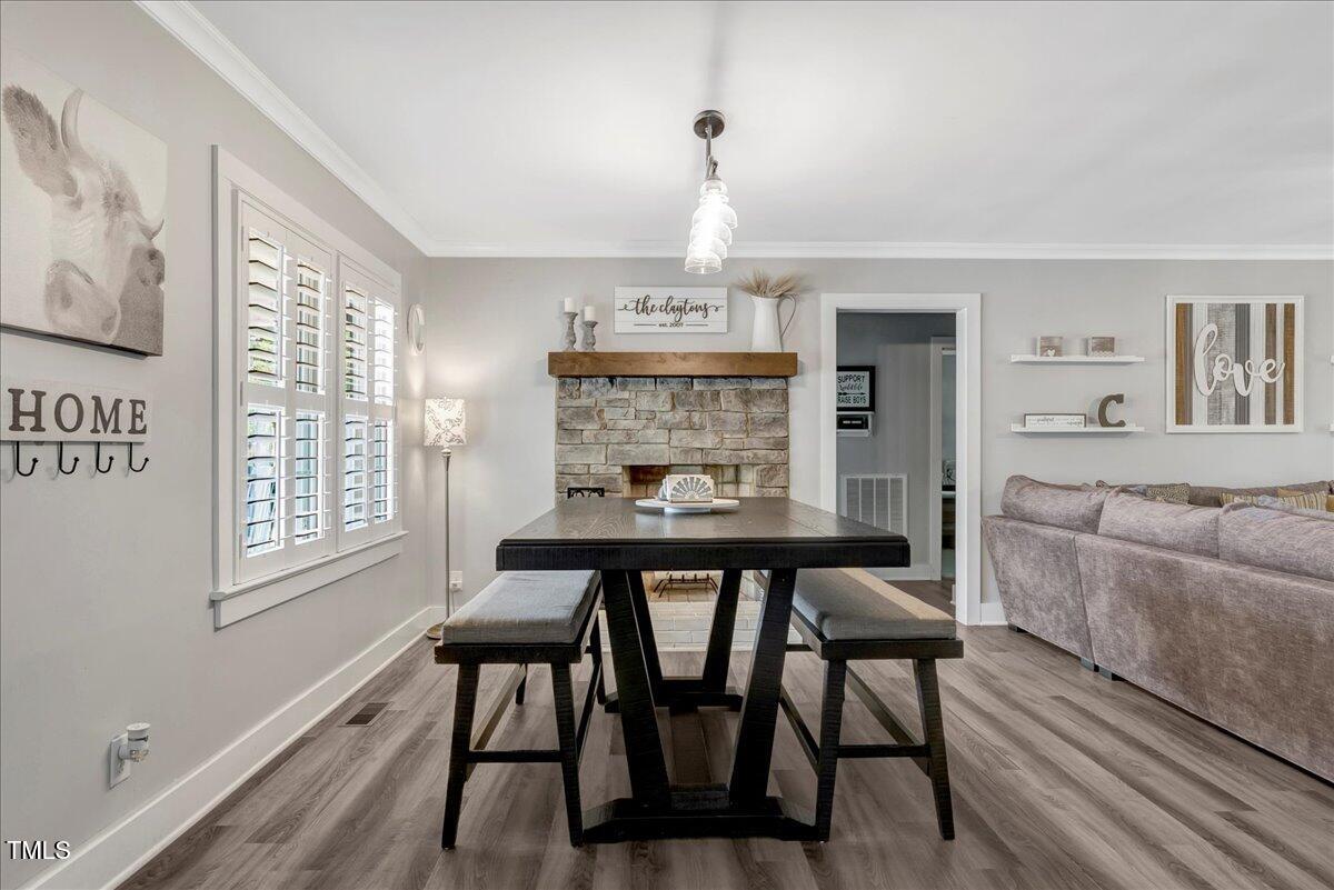 1856 Flat Rock Church Road Louisburg, NC 27549 - Photo 6 of 30 a view of a dining room with furniture window and wooden floor