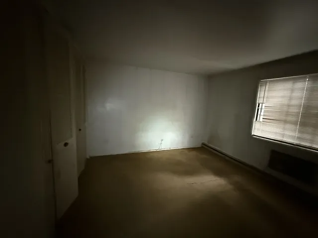 a view of an empty room and window
