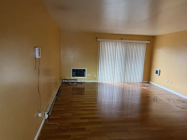 a view of a livingroom with wooden floor