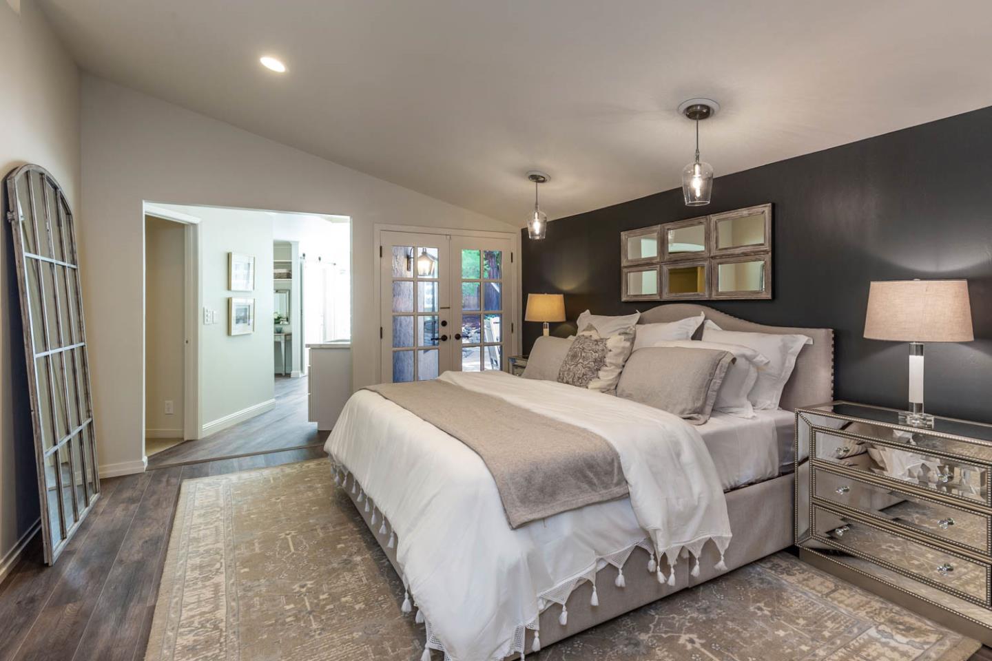 610 Magdalena Avenue Los Altos, CA 94024 - Photo 13 of 38 a spacious bedroom with a bed and a lamp