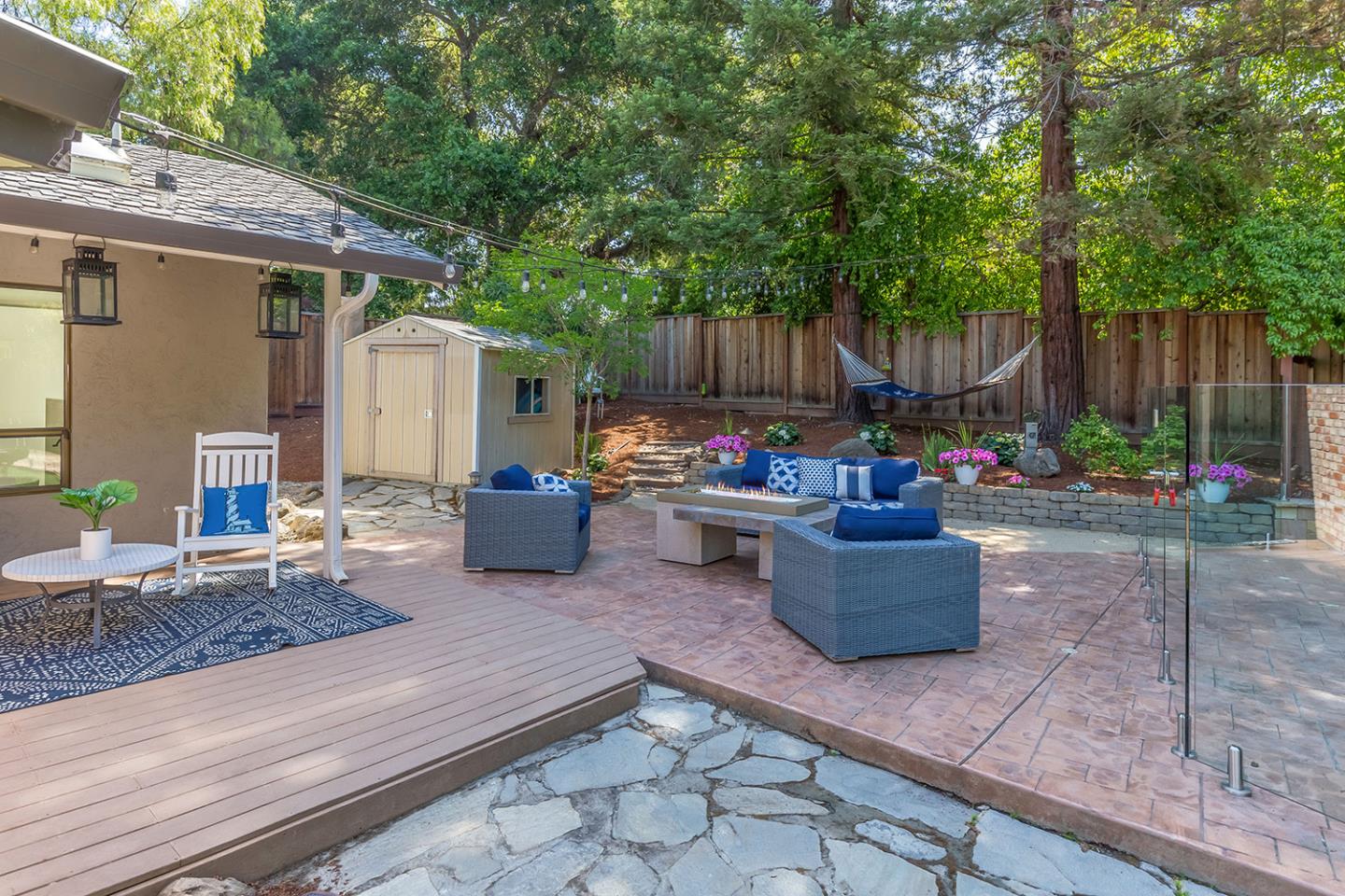 610 Magdalena Avenue Los Altos, CA 94024 - Photo 25 of 38 a view of a patio with table and chairs potted plants