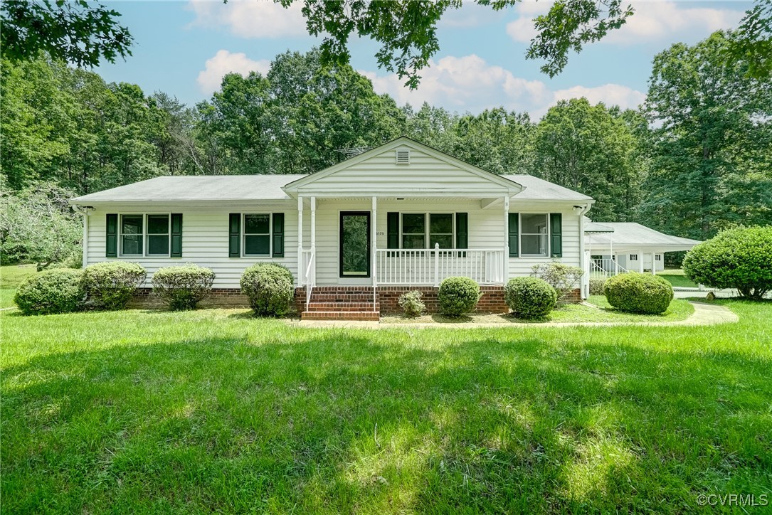 3175 Sandy Hook Road Sandy Hook, VA 23153 - Photo 1 of 27 a front view of a house with a yard