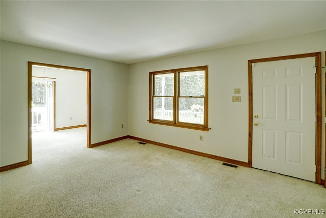 3175 Sandy Hook Road Sandy Hook, VA 23153 - Photo 12 of 27 an empty room with windows