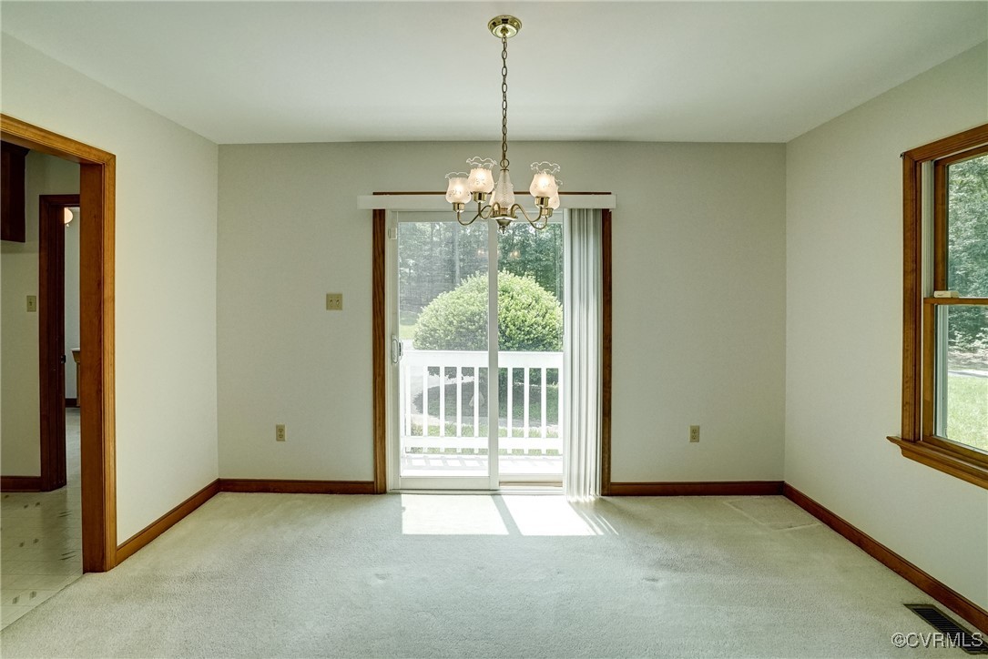 3175 Sandy Hook Road Sandy Hook, VA 23153 - Photo 13 of 27 a view of a room with a windows and chandelier
