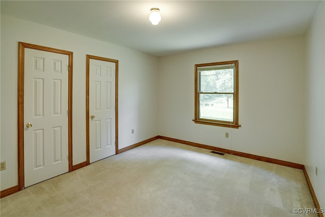 3175 Sandy Hook Road Sandy Hook, VA 23153 - Photo 19 of 27 an empty room with windows