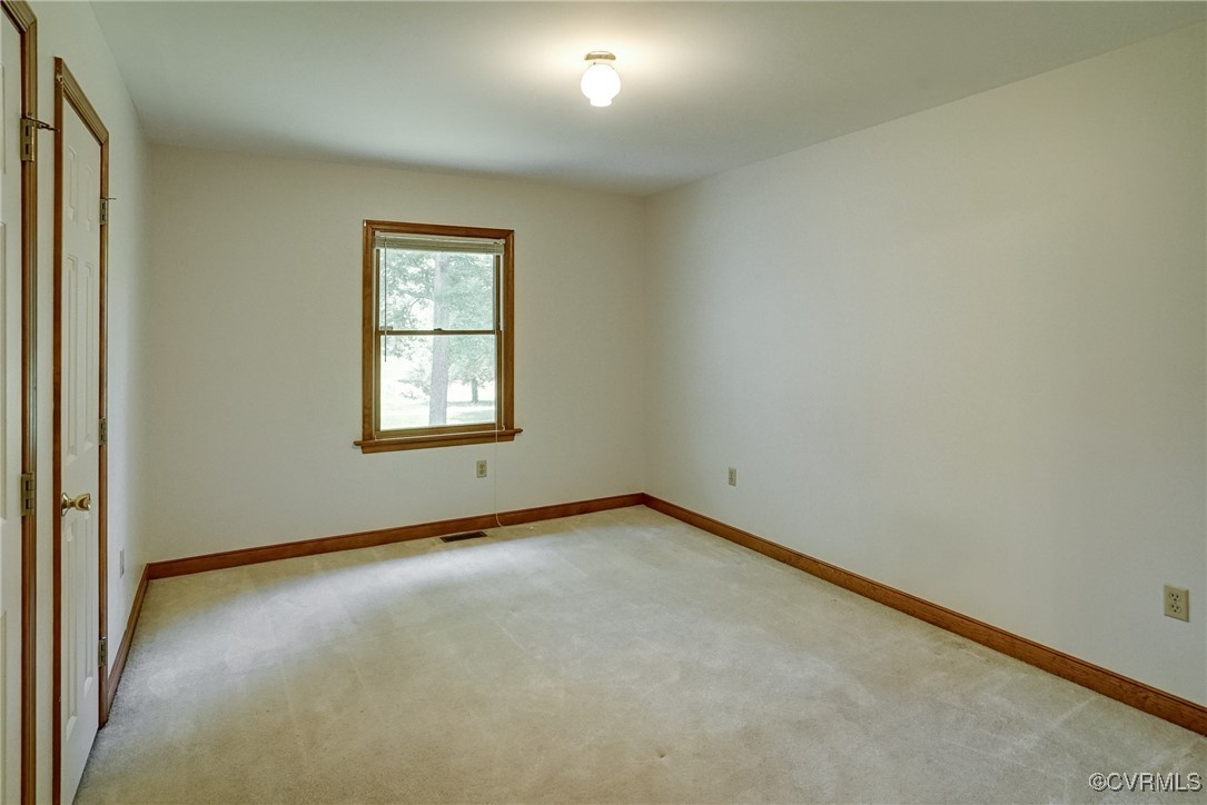 3175 Sandy Hook Road Sandy Hook, VA 23153 - Photo 20 of 27 an empty room with a window