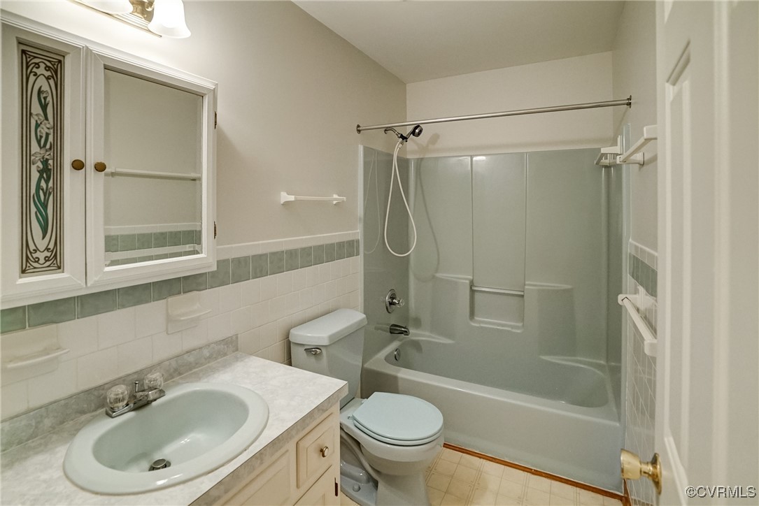 3175 Sandy Hook Road Sandy Hook, VA 23153 - Photo 21 of 27 a bathroom with a sink toilet and shower