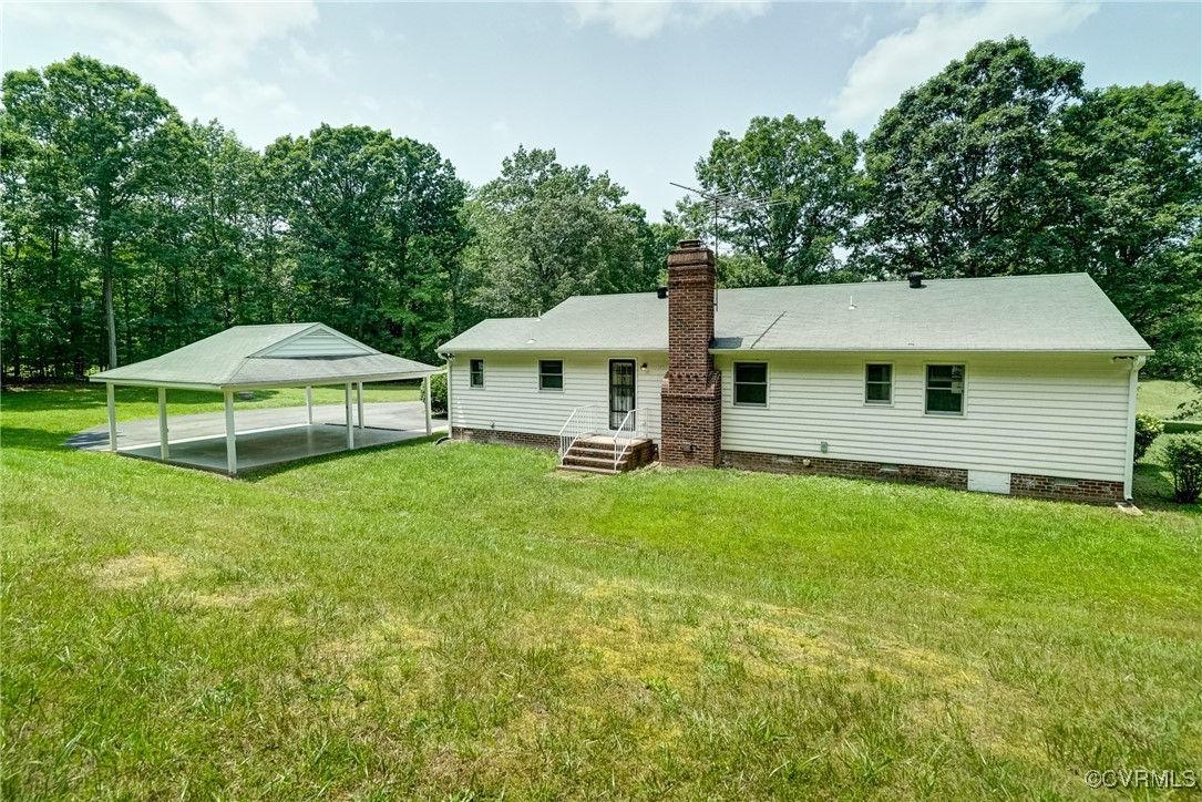 3175 Sandy Hook Road Sandy Hook, VA 23153 - Photo 26 of 27 a view of a house with backyard and garden
