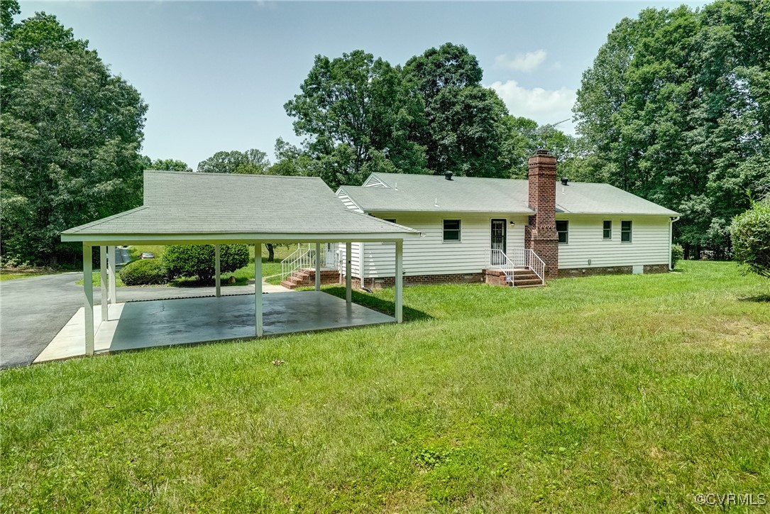 3175 Sandy Hook Road Sandy Hook, VA 23153 - Photo 5 of 27 a view of a house with a yard and sitting area