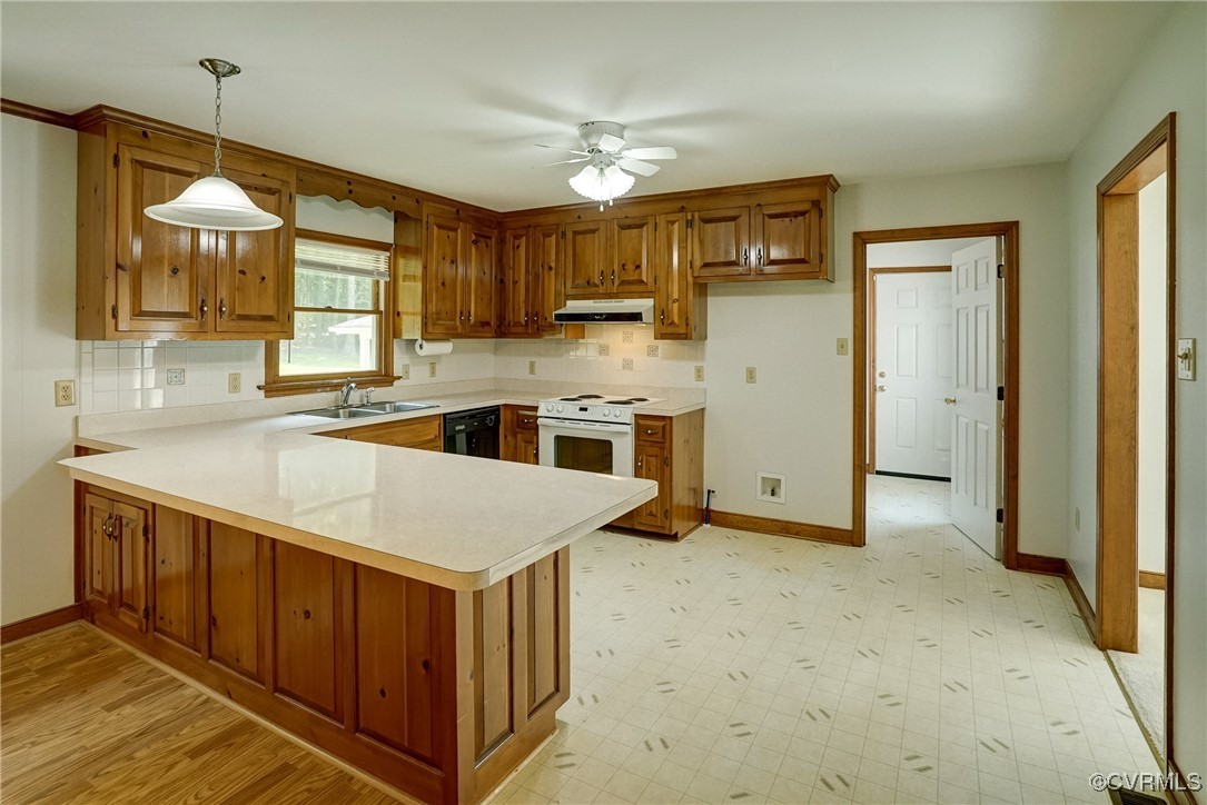 3175 Sandy Hook Road Sandy Hook, VA 23153 - Photo 8 of 27 a kitchen with stainless steel appliances granite countertop a sink a stove and a refrigerator