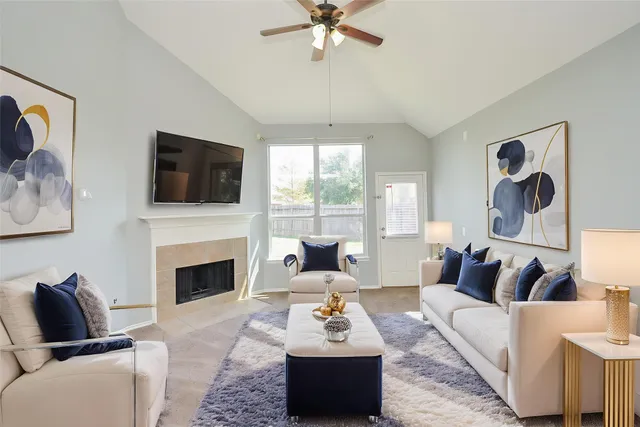 a living room with furniture fireplace and window