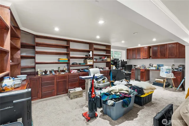 a living room with lots of furniture and clutter