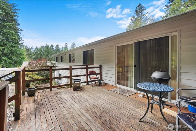 a balcony with table and chairs