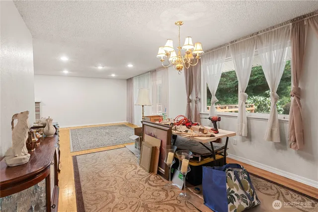 a view of a dining room with furniture window and outside view