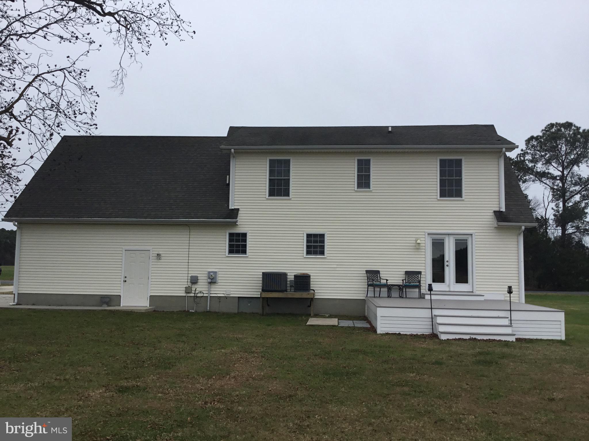 4810 Jacksonville Road Crisfield, MD 21817 - Photo 14 of 38 a view of a white house with a yard