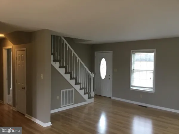 a view of entryway with wooden floor
