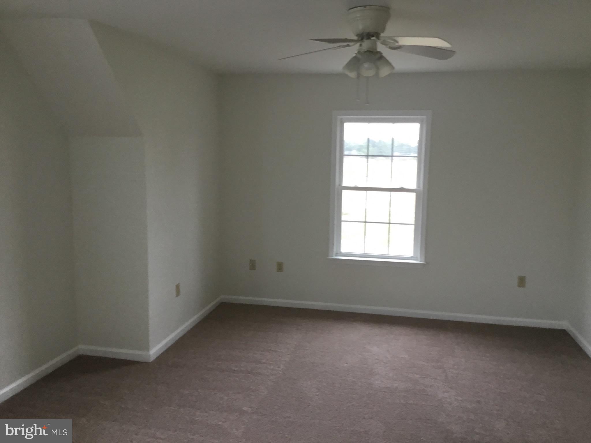 4810 Jacksonville Road Crisfield, MD 21817 - Photo 28 of 38 an empty room with a window and a fan