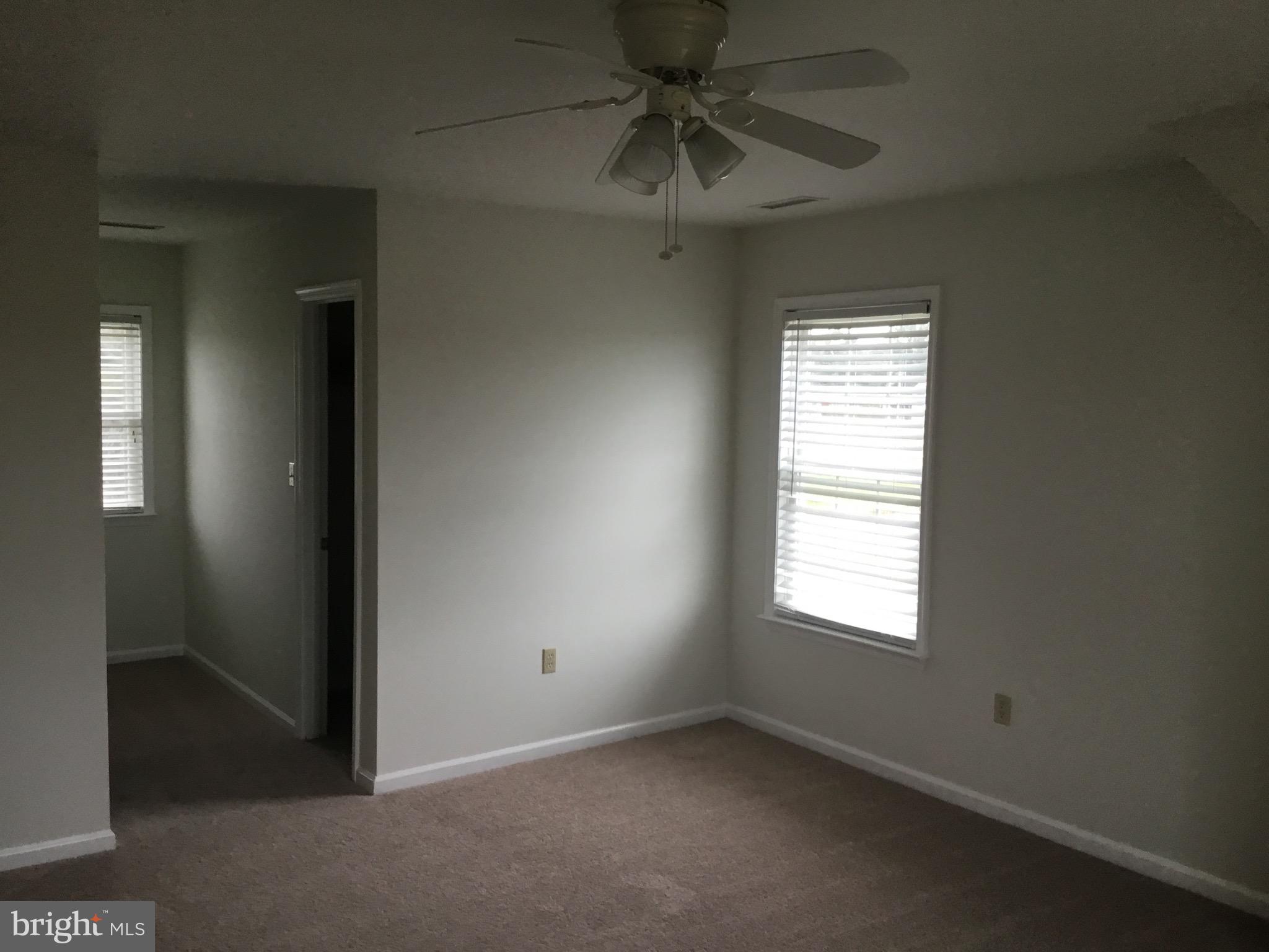 4810 Jacksonville Road Crisfield, MD 21817 - Photo 30 of 38 an empty room with a window and a fan