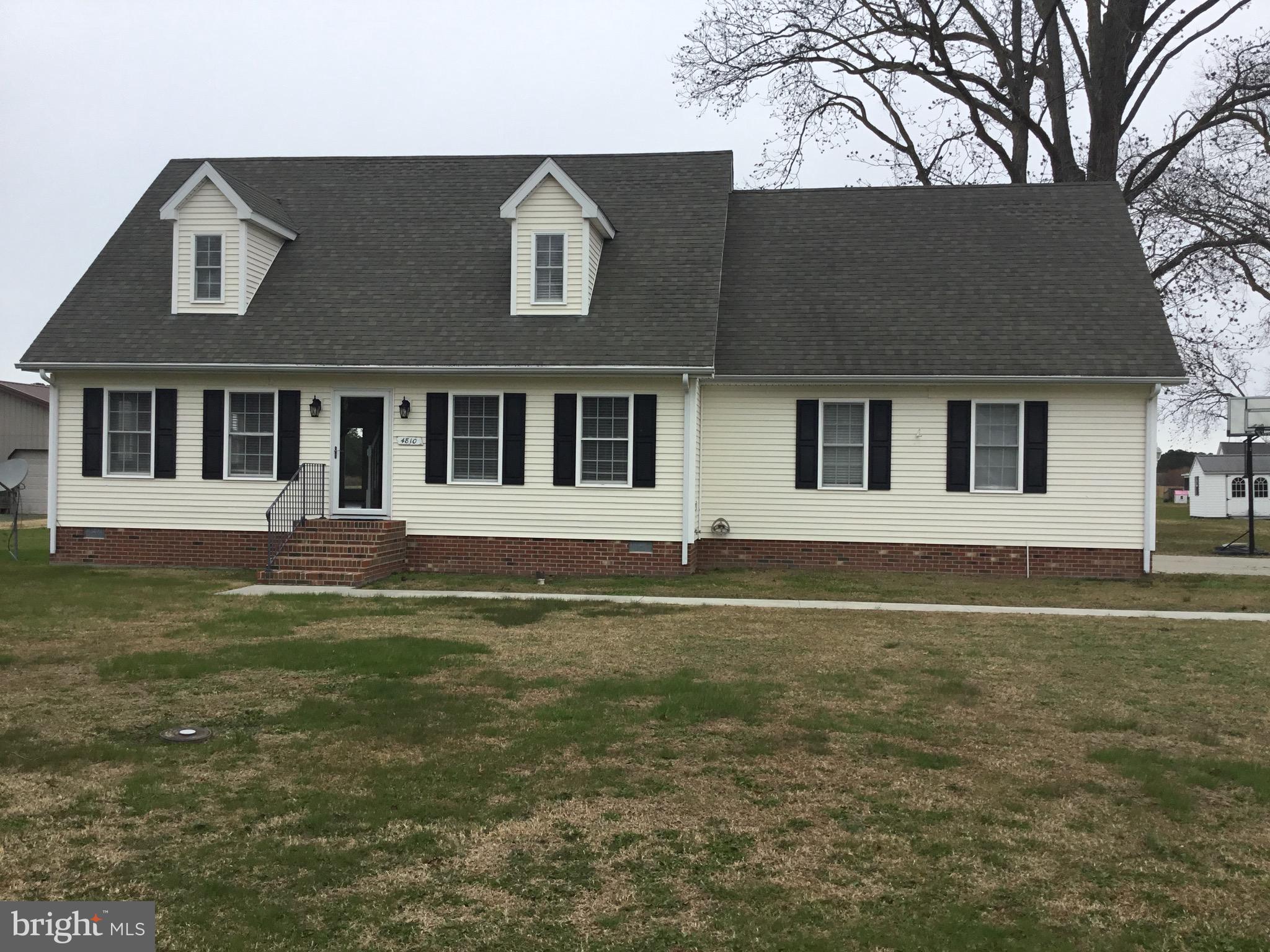 4810 Jacksonville Road Crisfield, MD 21817 - Photo 3 of 38 a front view of a house with a garden