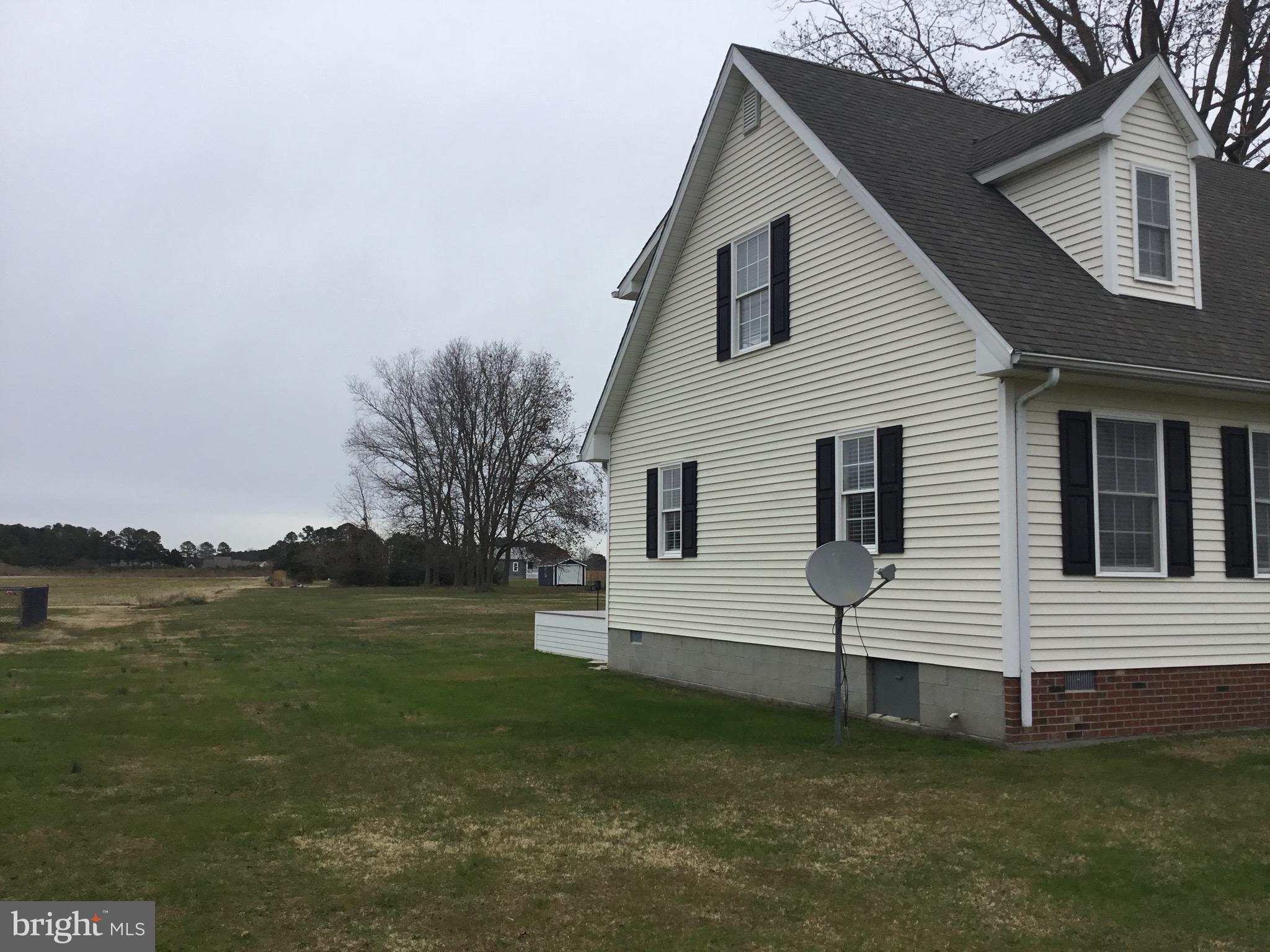 4810 Jacksonville Road Crisfield, MD 21817 - Photo 5 of 38 a view of a house with a yard