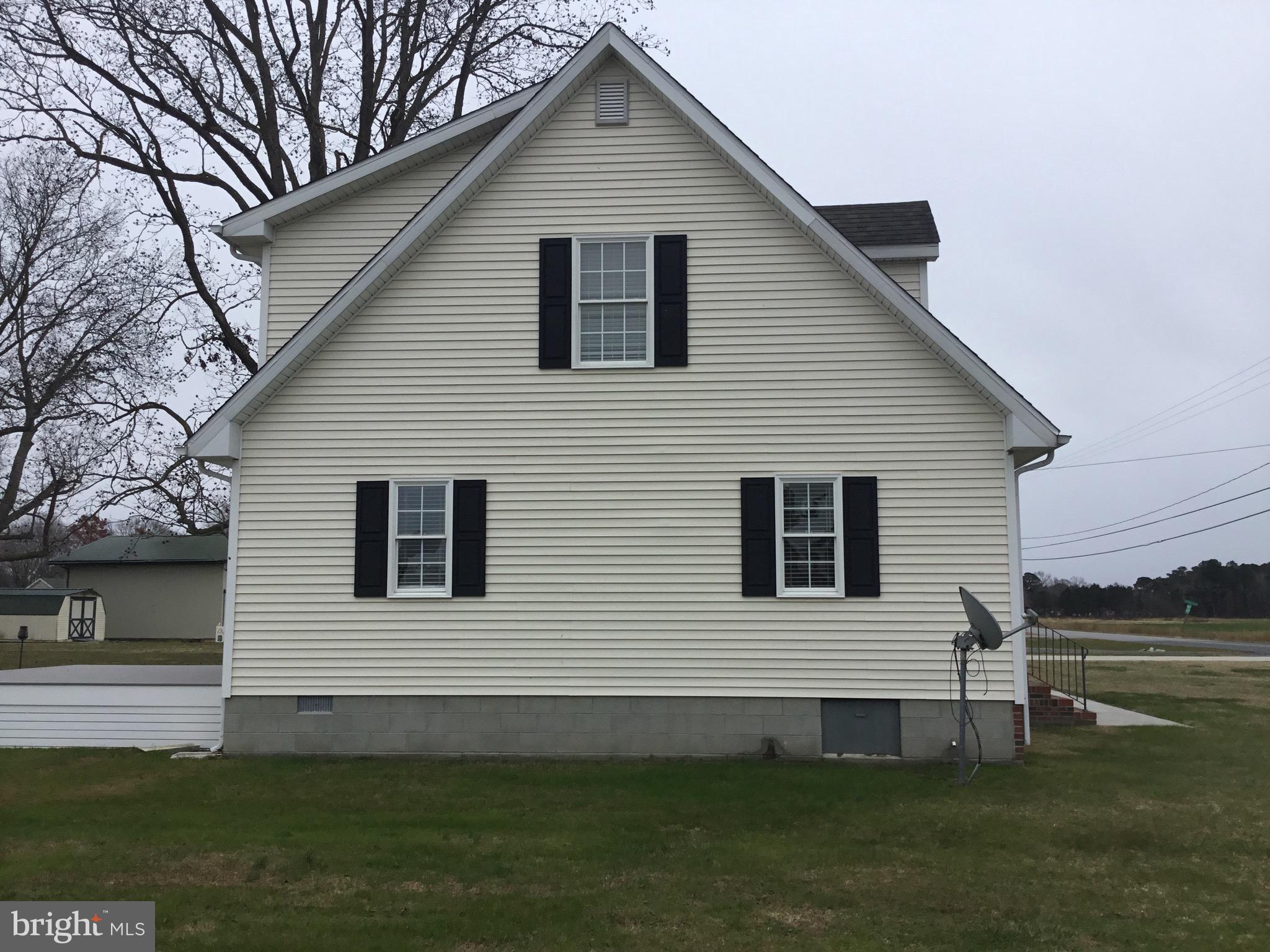 4810 Jacksonville Road Crisfield, MD 21817 - Photo 7 of 38 a front view of a house with a garden