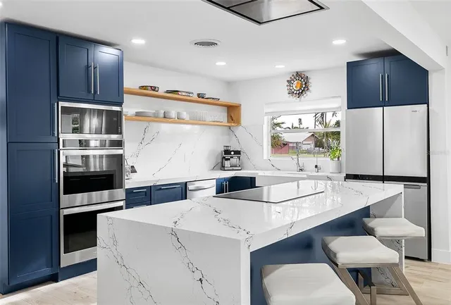 a spacious bathroom with a double vanity sink mirror and double