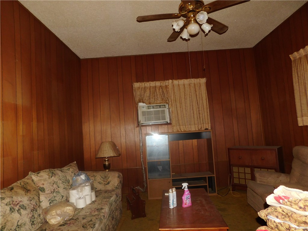 712 East 2nd Street Alice, TX 78332 - Photo 16 of 25 a bedroom with a bed and lamp