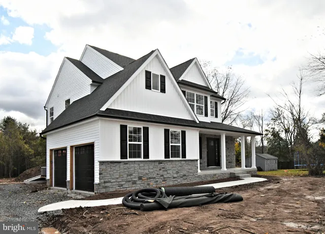 a front view of a house with yard