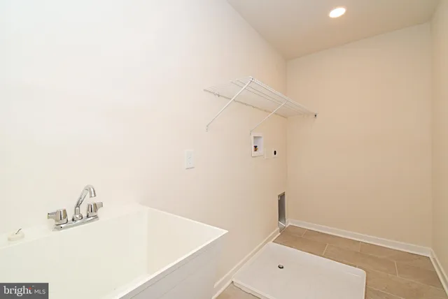 a bathroom with a window and a shower