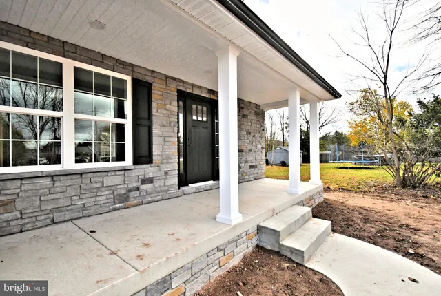 a view of swimming pool with patio
