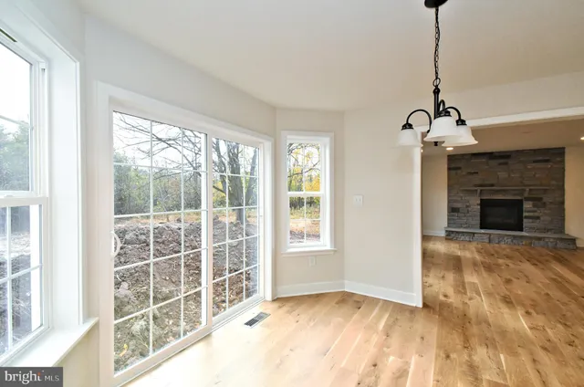 a kitchen with granite countertop a sink a stove and cabinets