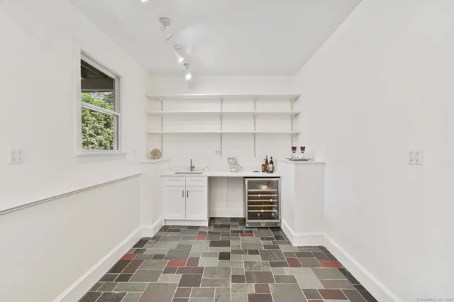 a kitchen with a stove and a cabinets