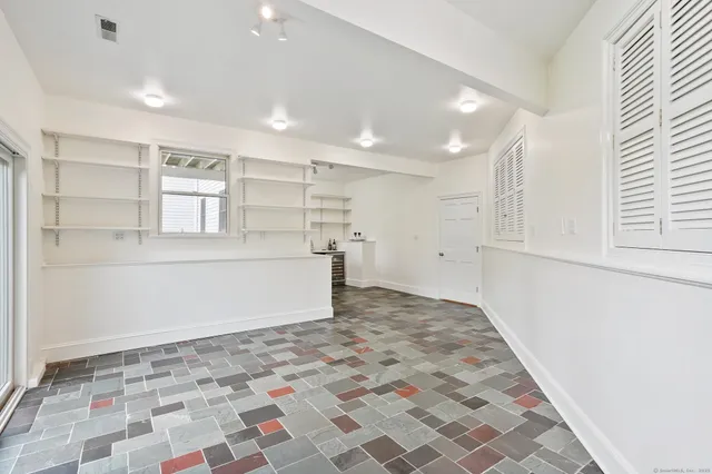 a view of an empty room and window