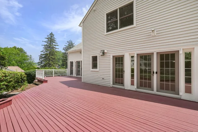 a porch with seating space and yard in back
