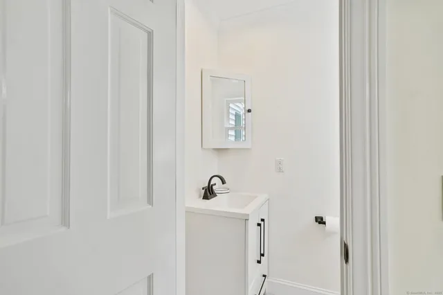 a bathroom with a sink and mirror