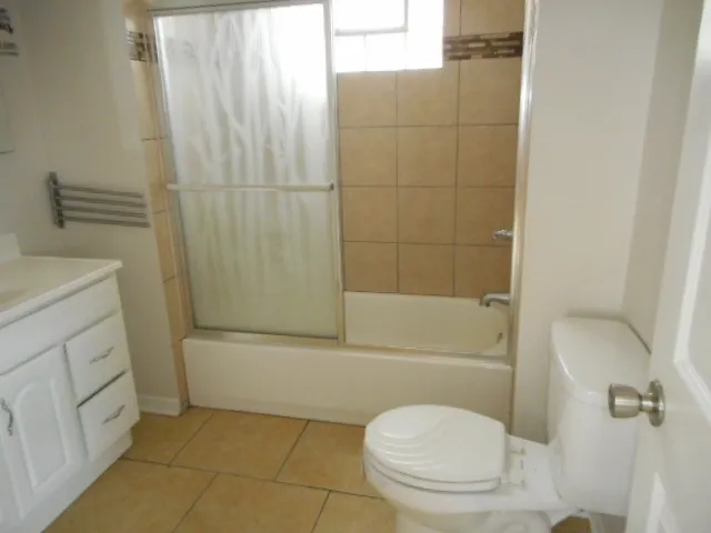 a bathroom with a sink a toilet and bathtub