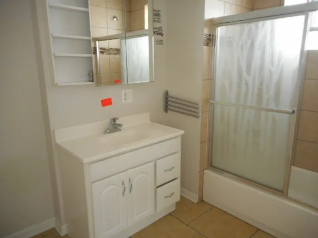 a bathroom with a sink and mirror