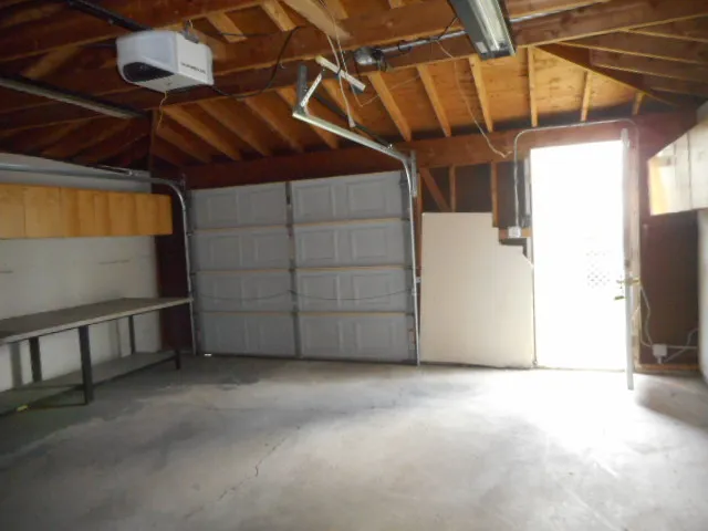 a view of house with wooden fence