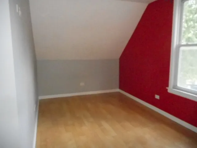 a view of an empty room and a window