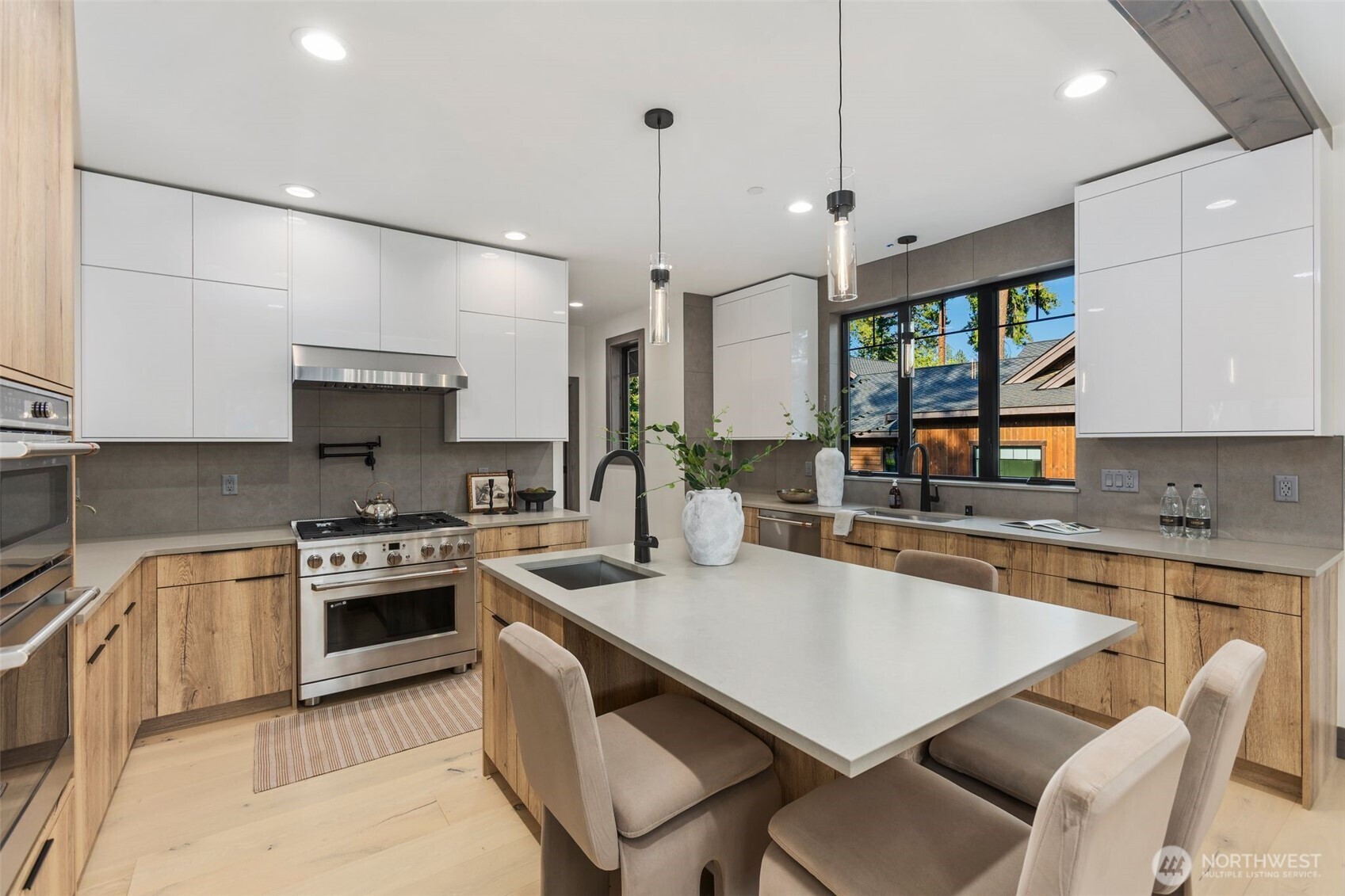90 Portal Cle Elum, WA 98922 - Photo 10 of 38 a kitchen with a stove a sink a dining table and chairs