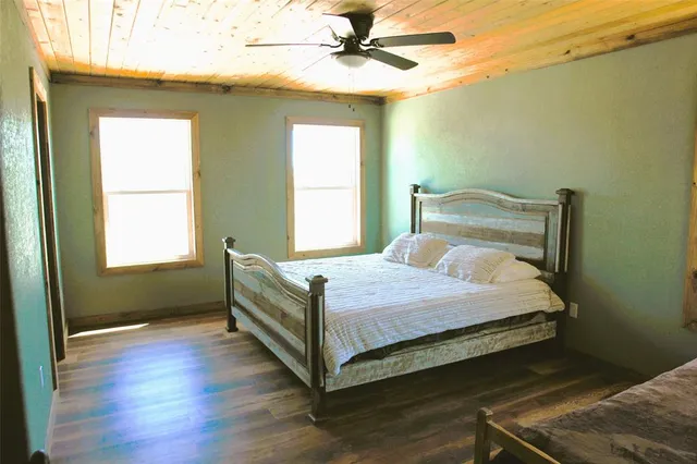 a bedroom with a bed and window